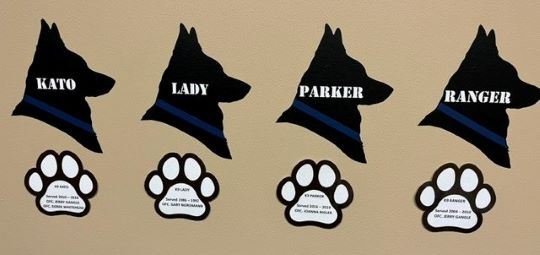 Multiple Dog heads with paw prints cropped