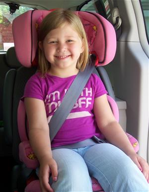 Girl in a booster seat